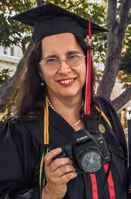 Connie at her graduation with her canon camera.